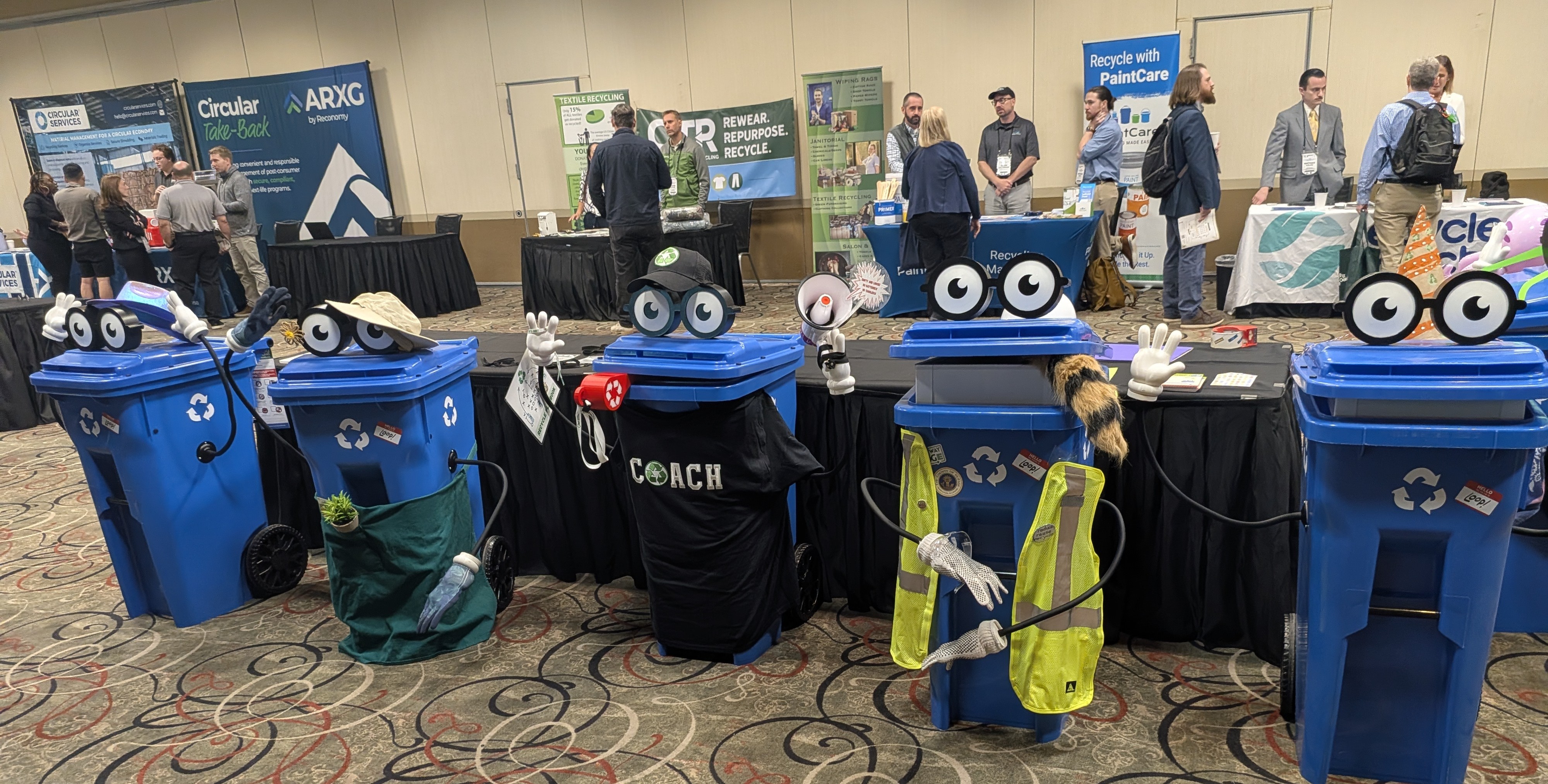 Five decorated Loop recycling carts on display at ICC 2026
