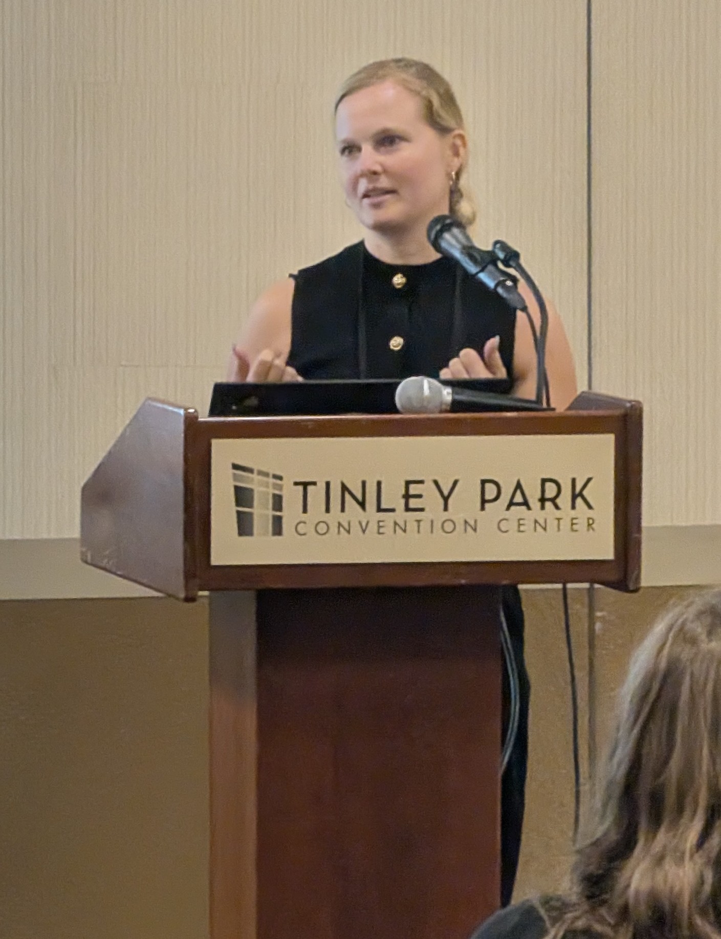Aleksandra Plewa at the podium during her ICC 2026 presentation