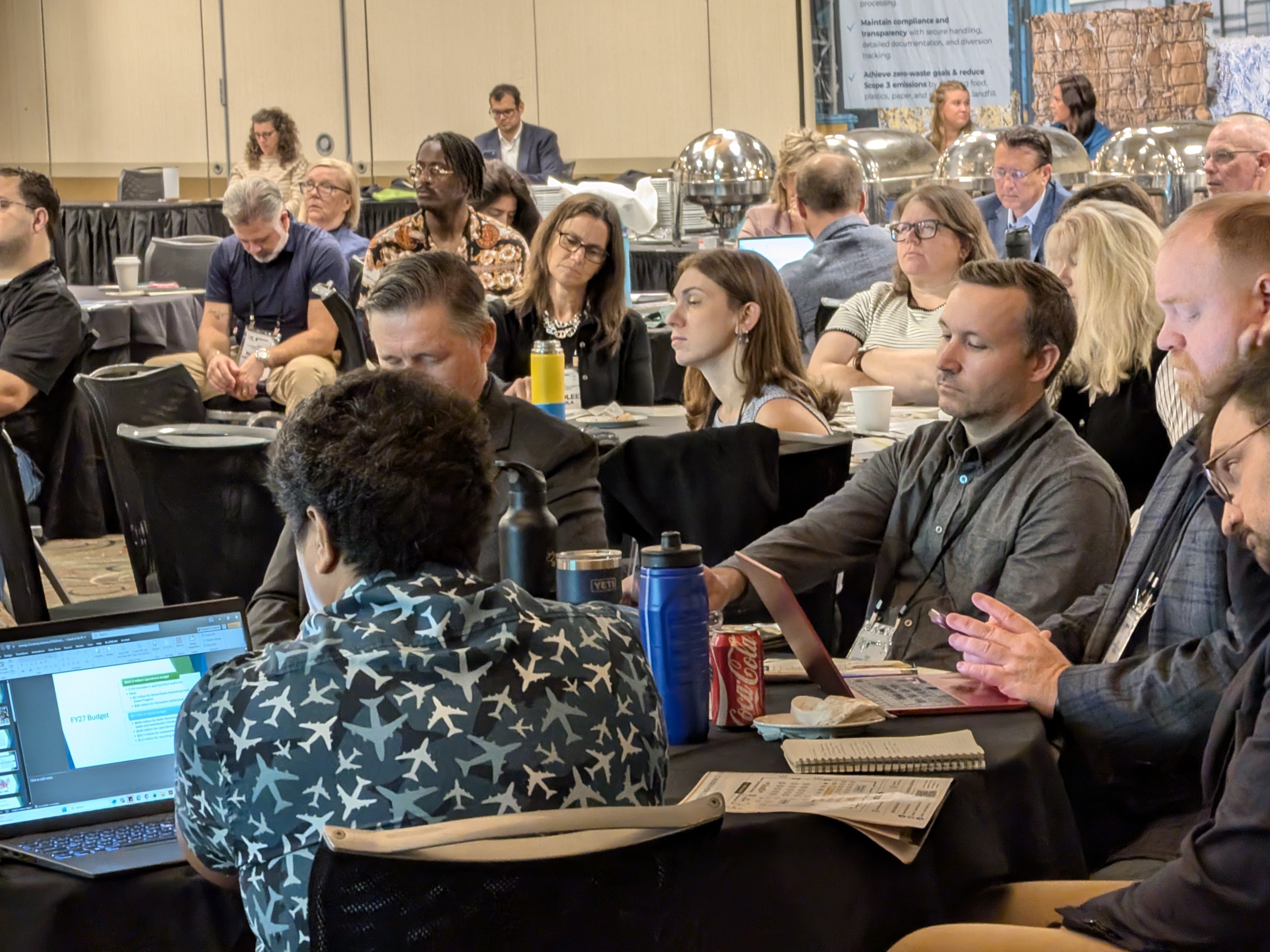 ICC 2026 attendees seated at tables during a session