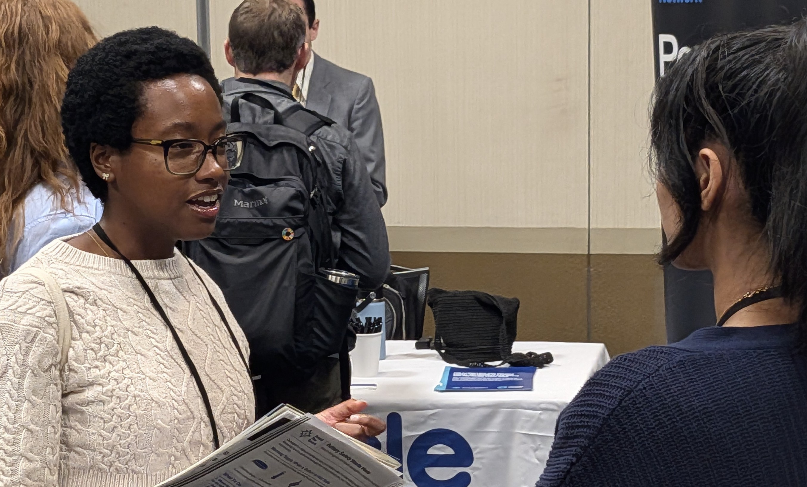 Brianna Moore talking in the ICC 2026 exhibition area