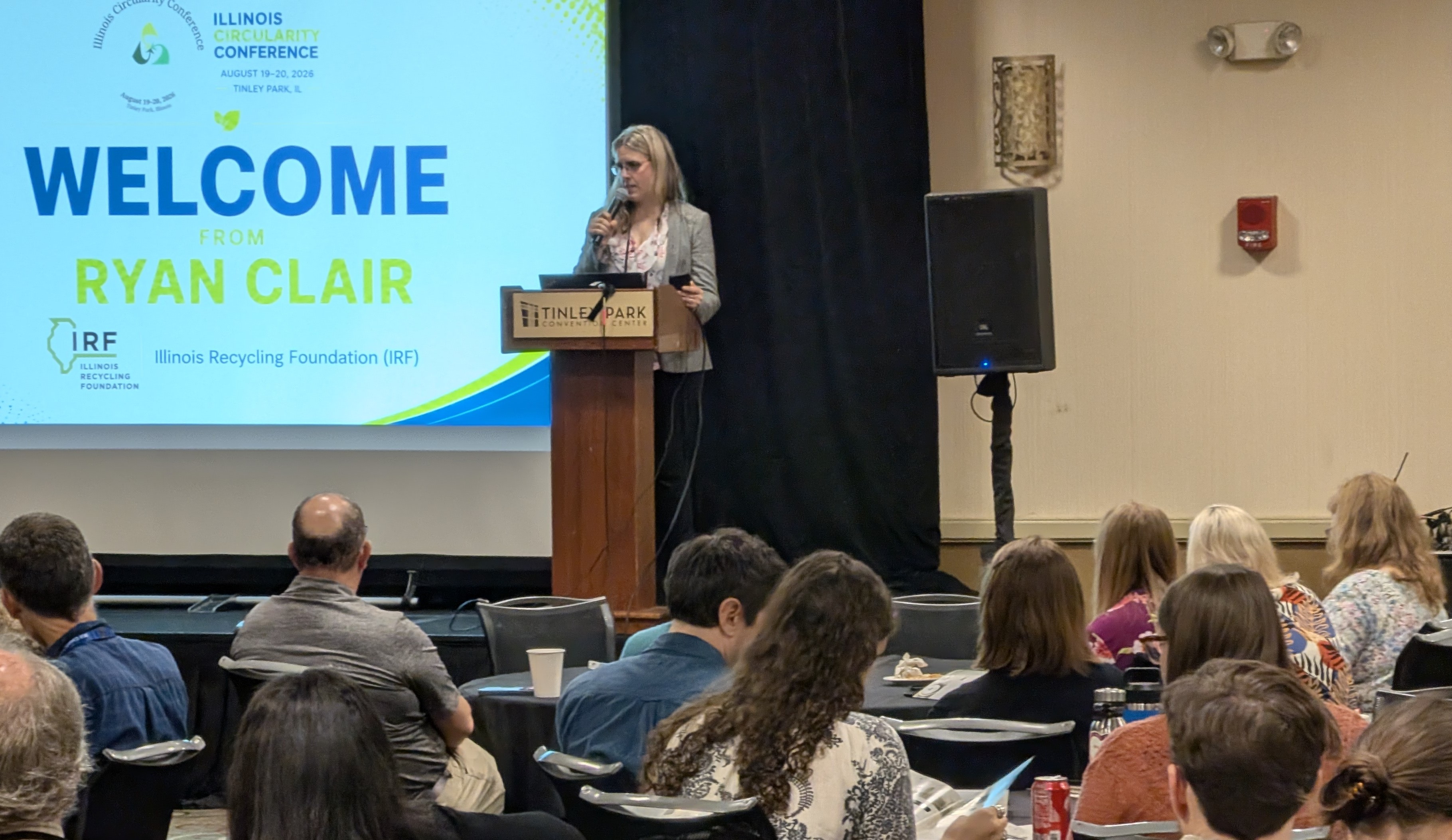 Clair Ryan welcoming ICC 2026 attendees from the podium