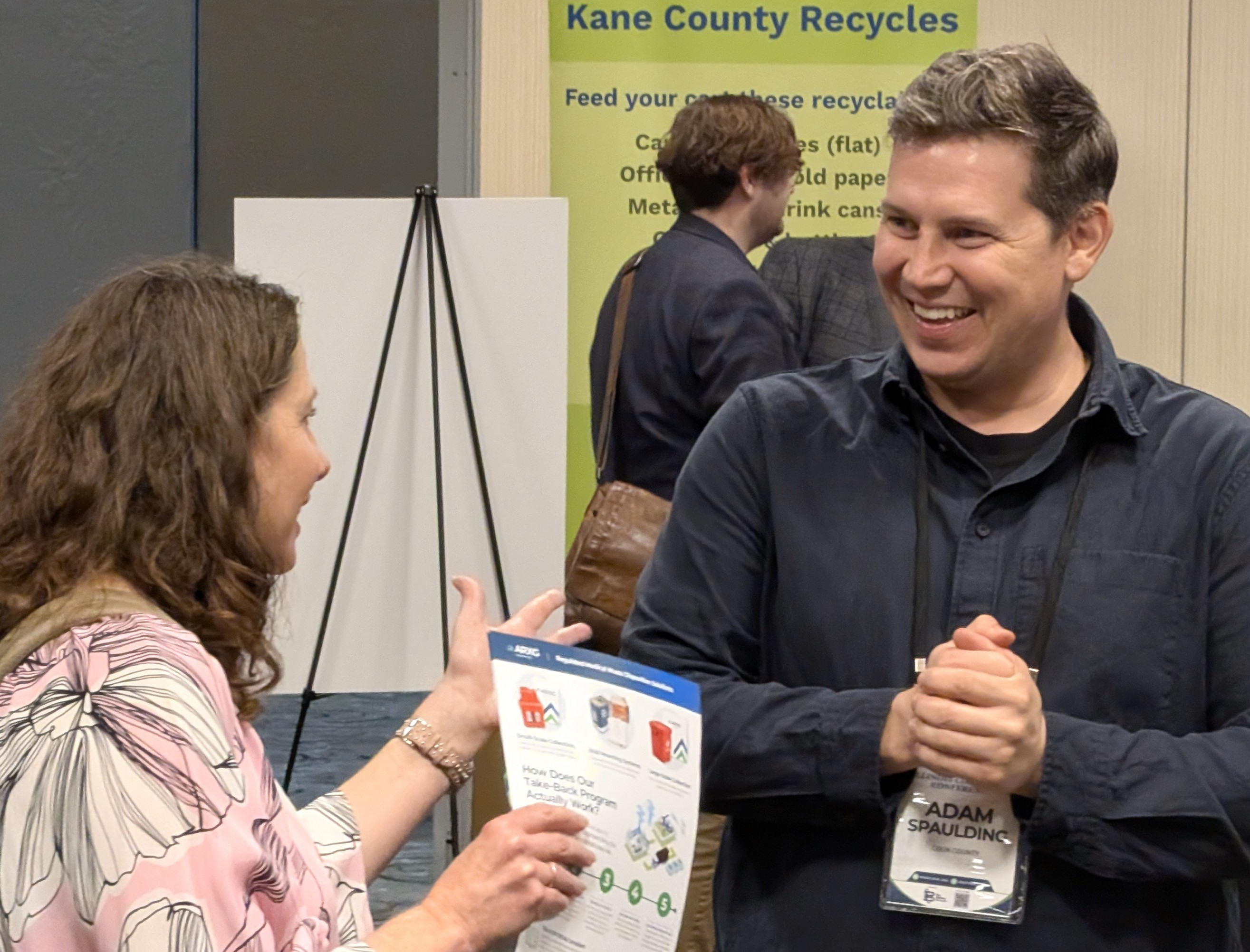 Two ICC 2026 attendees talking during a conference break